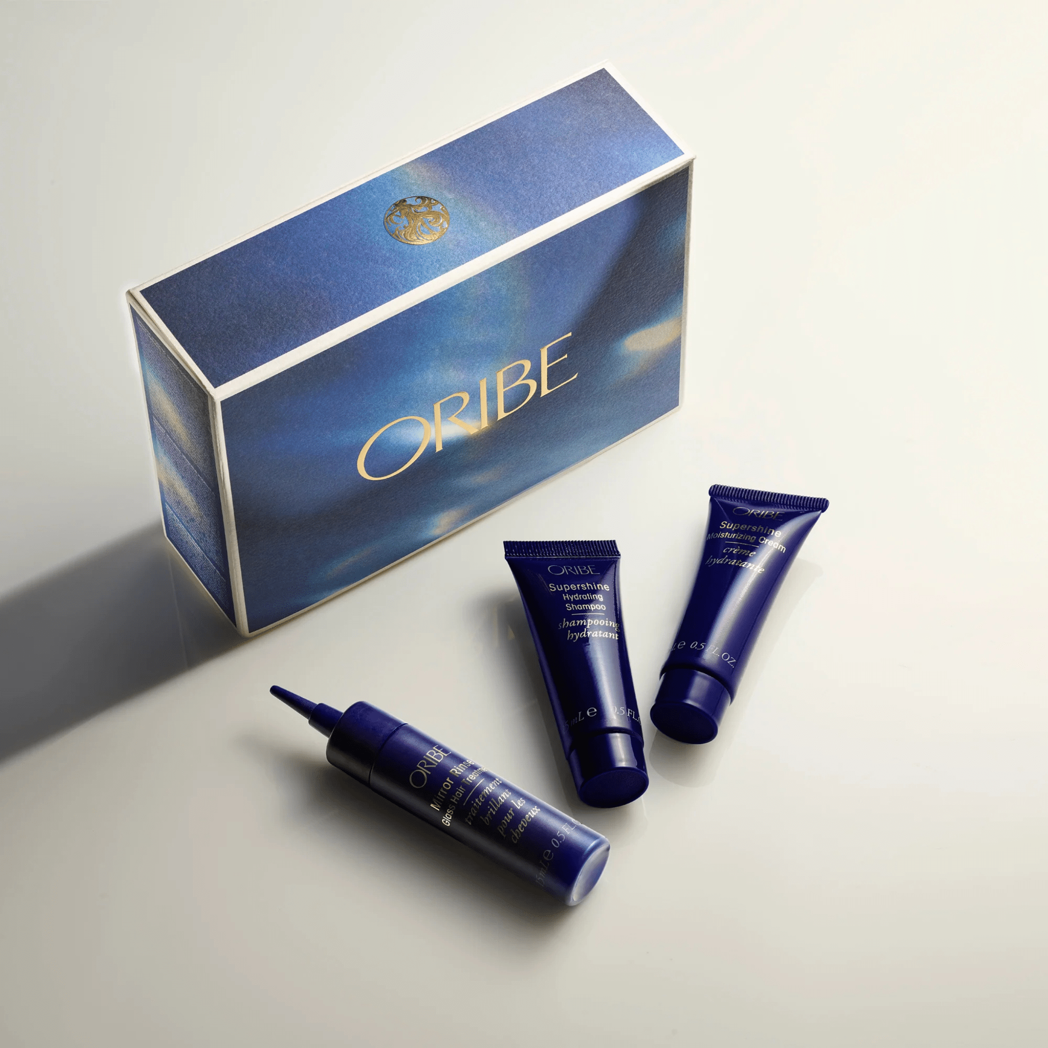 Prime avec Achat - Oribe. Trousse Éclat Supershine - Shampoing, Crème et Traitement - Concept C. Shop