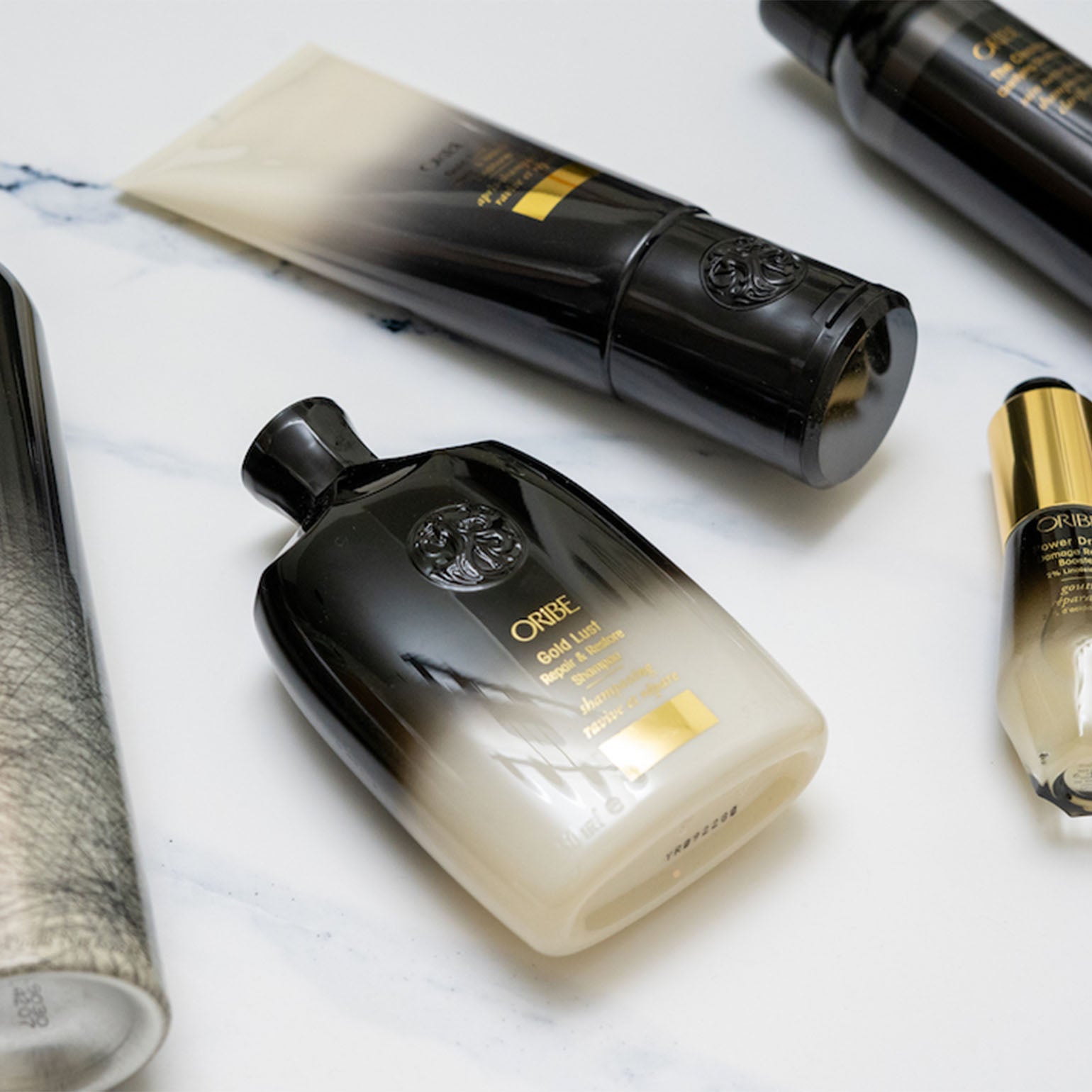 Oribe. Shampoing Ravive et Répare Gold Lust - 75 ml - Concept C. Shop